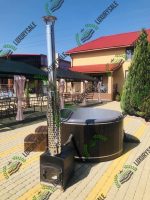 СПА купель Елегант плюс біля будинку з червоним дахом